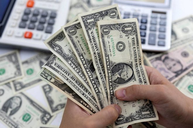FILE PHOTO: Illustration shows U.S. Dollar banknotes – المضارب العربي