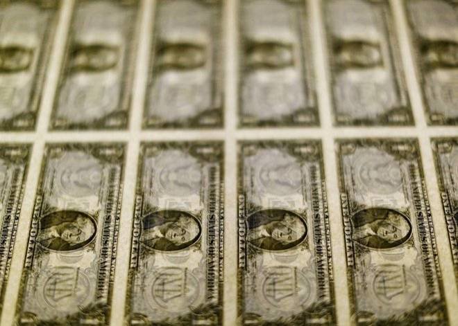 FILE PHOTO: File photo of United States one dollar bills seen on a light table at the Bureau of Engraving and Printing in Washington – المضارب العربي